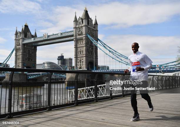 Mo Farah of Great Britain runs in front of Tower Bridge prior to the weekends Virgin Money London Marathon on April 17, 2018 in London, England.