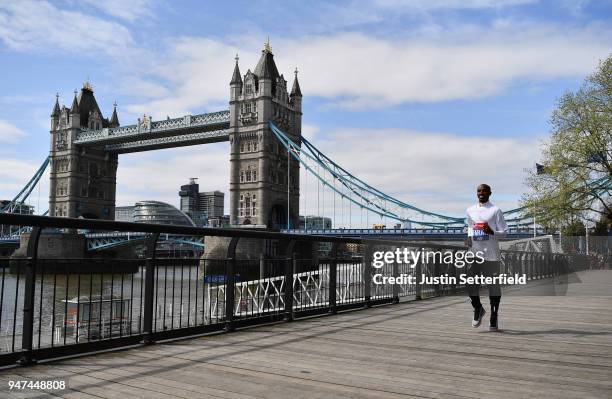 Mo Farah of Great Britain runs in front of Tower Bridge prior to the weekends Virgin Money London Marathon on April 17, 2018 in London, England.