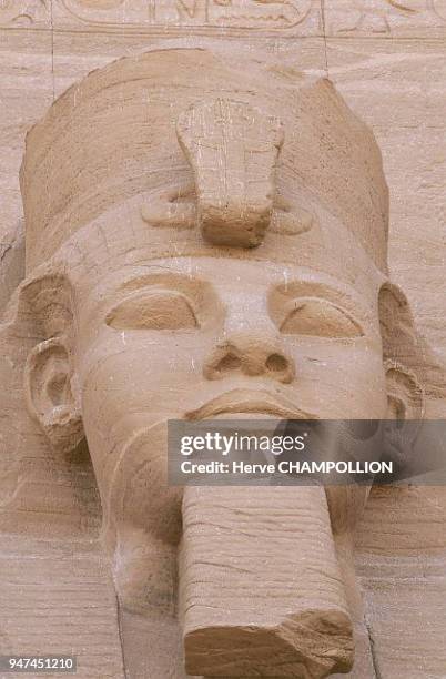 Egypt, Ramses II, speos temple of Abu Simbel, Nubia. Before the facade of the speos temple in the mountain, four colossus' of Ramses II stand guard....