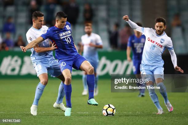 Gio of Shanghai Shenhua FC competes with Bobo of Sydney during the AFC Champions League match between Sydney FC and Shaghai Shenhua at Sydney...