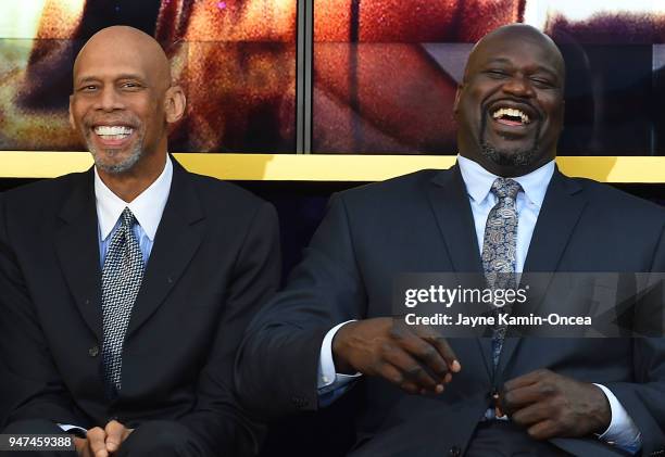 Los Angeles Lakers Kareem Abdul-Jabbar and Shaquille O'Neal share a laugh with Hall of Famer Elgin Baylor during the unveiling ceremony for a bronze...