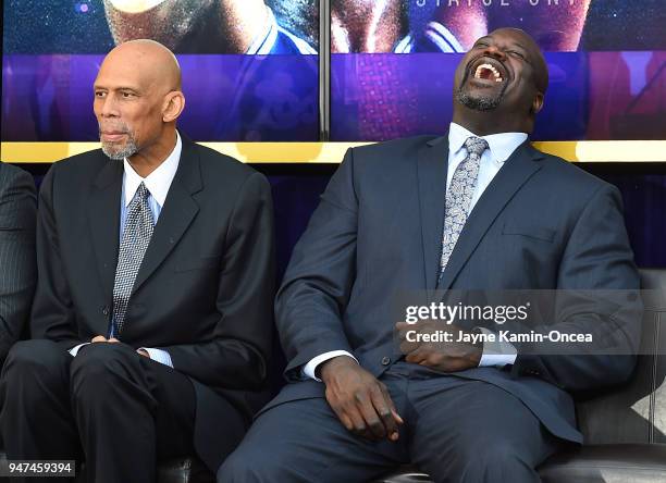 Los Angeles Lakers Kareem Abdul-Jabbar and Shaquille O'Neal share a laugh with Hall of Famer Elgin Baylor during the unveiling ceremony for a bronze...