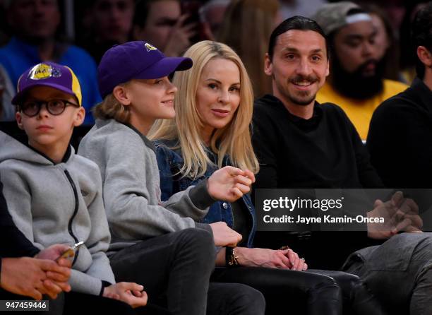 Zlatan Ibrahimovi"u008d of the Los Angeles Galaxy attends the game between the Los Angeles Lakers and the Minnesota Timberwolves with his wife Helena...