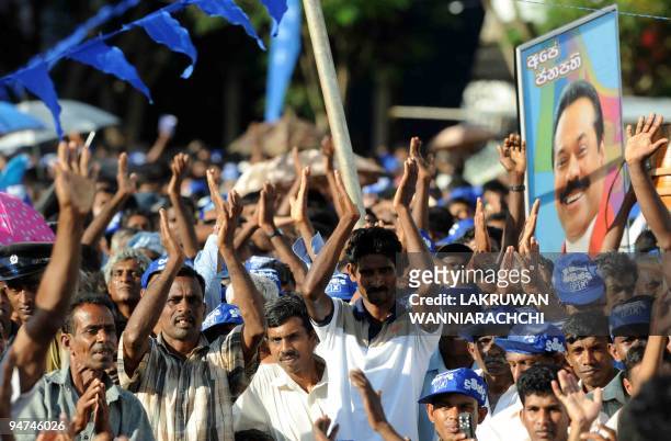 Supporters of Sri Lanka's President Mahinda Rajapakse attend an election rally in the historic Buddhist temple town of Anuradhapura on December 18,...