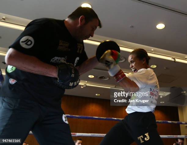Natash Jonas works the pads with trainer Joe Gallagher during a Meida Work Out at the Hilton Hotel on April 17, 2018 in Liverpool, England.
