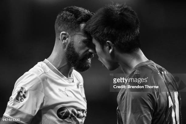 Alex Brosque of Sydney butts heads with Sun Kai of Shanghai Shenhua FC during the AFC Champions League match between Sydney FC and Shaghai Shenhua at...