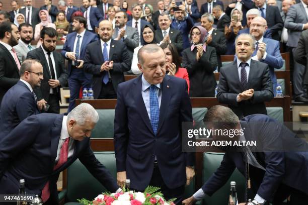 President of Turkey and Leader of the Justice and Development Party , Recep Tayyip Erdogan , flanked by Prime Minister of Turkey and Vice Chairman of...