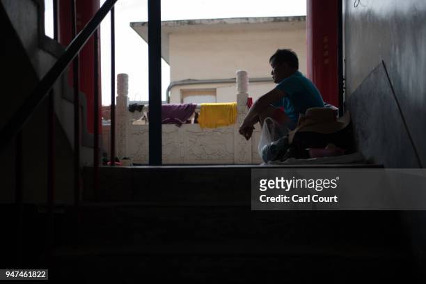 Man rests at a pilgrims rest house near Xingang Fengtian Temple where a statue of Mazu is being displayed before continuing the nine day Mazu...