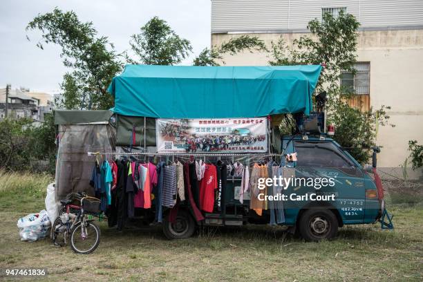 Pilgrim's van is laden with drying clothes as it is parked near Xingang Fengtian Temple where the statue of Mazu is being displayed for one day...