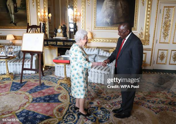 Queen Elizabeth II shows South African President Cyril Ramaphosa letters between her and Nelson Mandela on South Africa returning to the Commomwealth...