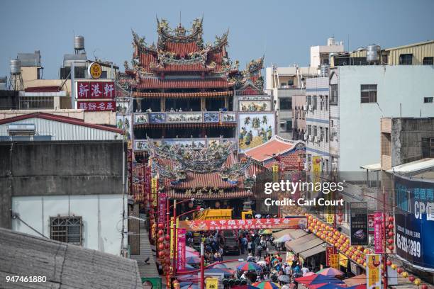 Xingang Fengtian Temple looms over nearby buildings as people visit the building on day five of the nine day Mazu pilgrimage, on April 17, 2018 in...