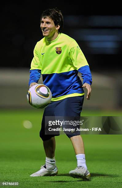 Lionel Messi of FC Barcelona juggles the ball during a training session on December 18, 2009 in Abu Dhabi, United Arab Emirates. Barcelona will face...