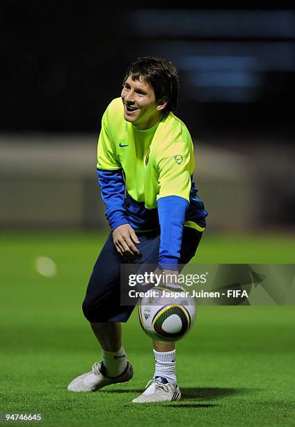 Lionel Messi of FC Barcelona juggles the ball during a training session on December 18, 2009 in Abu Dhabi, United Arab Emirates. Barcelona will face...