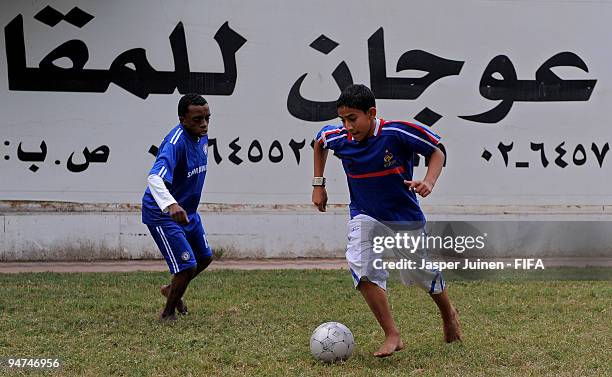 Local children play football in shirts of their favorite teams on December 18, 2009 in Abu Dhabi, United Arab Emirates. Abu Dhabi is hosting the FIFA...