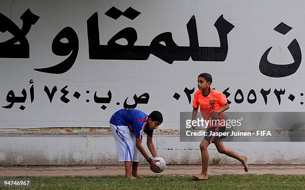 Local children play football in shirts of their favorite teams on December 18, 2009 in Abu Dhabi, United Arab Emirates. Abu Dhabi is hosting the FIFA...