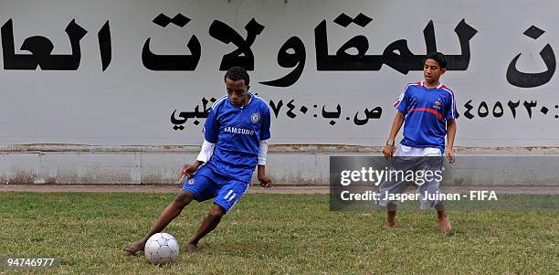 Local children play football in shirts of their favorite teams on December 18, 2009 in Abu Dhabi, United Arab Emirates. Abu Dhabi is hosting the FIFA...