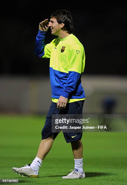 Lionel Messi of FC Barcelona smiles during a training session on December 18, 2009 in Abu Dhabi, United Arab Emirates. Barcelona will face...