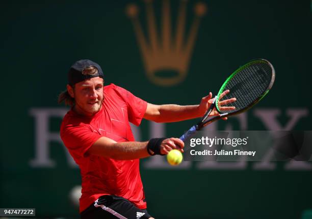 Lucas Pouille of France hits a backhand return during his Mens Singles match against Mischa Zverev of Germany at Monte-Carlo Sporting Club on April...