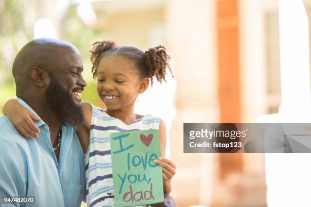 happy father's day. girl gives card to dad. - father gift stock pictures, royalty-free photos & images