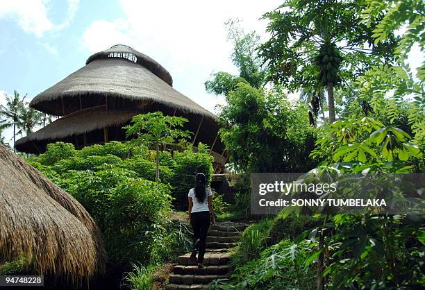 Climate-Indonesia-environment-education,FEATURE, by Stephen Coates A woman walks at a green school in Badung on December 9, 2009. Founded in 2008 by...