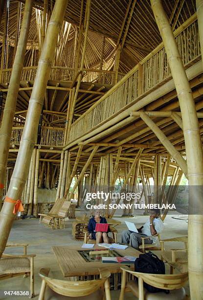 Climate-Indonesia-environment-education,FEATURE, by Stephen Coates Teachers sit at a main building of green school in Badung on December 9, 2009....
