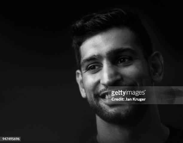 Amir Khan talks to the media during a Press Conference ahead of his fight with Phil Lo Greco at the Hilton Hotel on April 17, 2018 in Liverpool,...