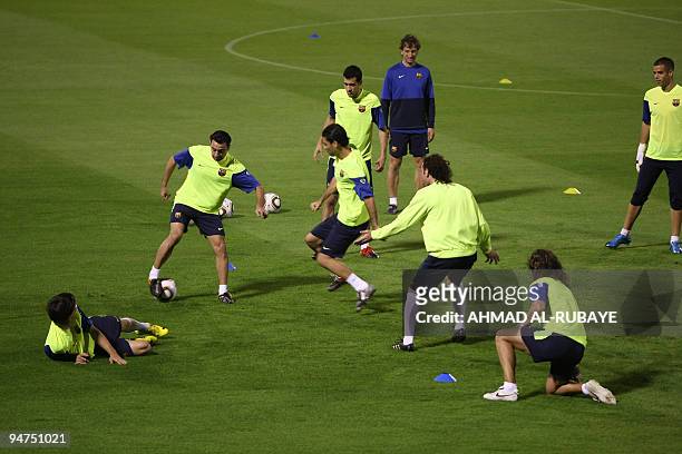 Barcelona's players practice during a training session in the Gulf emirate of Abu Dhabi on December 18 on the eve of their 2009 FIFA Club World Cup...