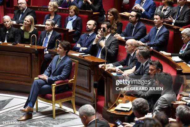 Canadian Prime Minister Justin Trudeau sits in front of members of the French Government prior to delivering a speech at the French National Assembly...