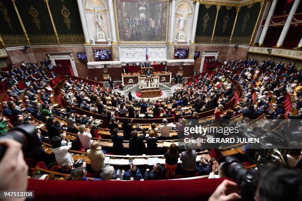French lawmakers applaud as Canadian Prime Minister Justin Trudeau delivers a speech at the French National Assembly in Paris, on April 17 as part of...