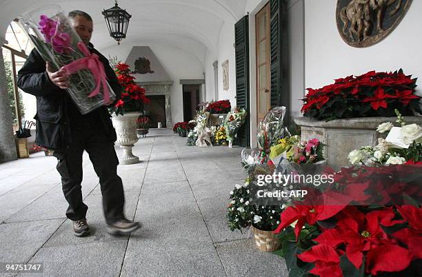 Flowers are delivered at Villa San Martino, the house where Italian Prime Minister Silvio Berlusconi is getting some rest after leaving hospital the...