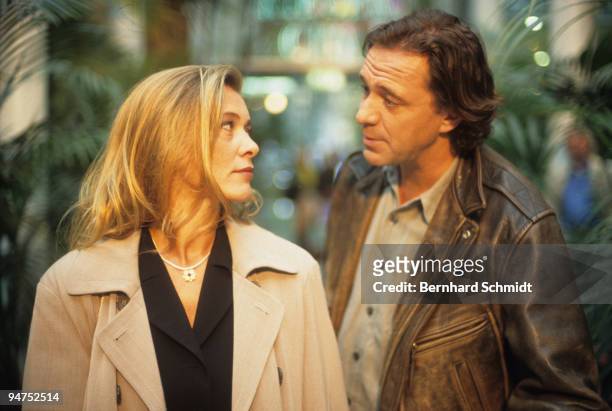 Actress Barbara Rudnik acts with actor Gerd Silberbauer at the set of the ZDF Movie "Im Atem der Berge" on October 14, 1997 in Munich, Germany