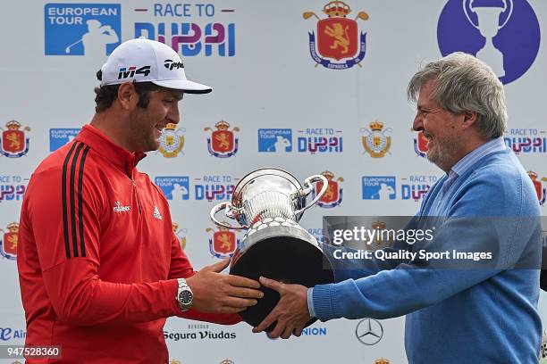 Jon Rahm of Spain poses with the trophy after winning the Open de Espana with Inigo Mendez de Vigo during day four of Open de Espana at Centro...