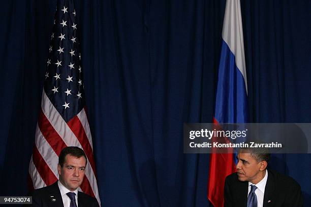 President Barack Obama sits with his Russian counterpart Dmitry Medvedev after the session of United Nations Climate Change Conference December 18,...