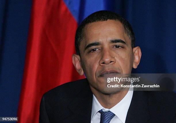 President Barack Obama sits with his Russian counterpart Dmitry Medvedev after the session of United Nations Climate Change Conference December 18,...