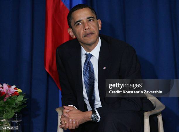 President Barack Obama sits with his Russian counterpart Dmitry Medvedev after the session of United Nations Climate Change Conference December 18,...