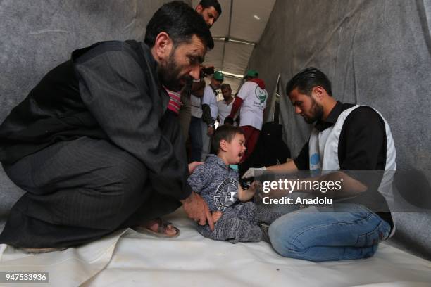 Syrian child is vaccinated during the measles campaign in Al-Bab district of Aleppo, Syria on April 17, 2018. Kids fled from Eastern Ghouta's Douma...