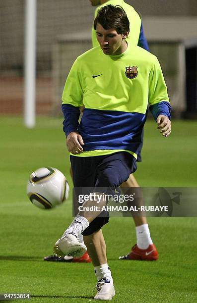 Barcelona's Argentine striker Lionel Messi practices during a training session in the Gulf emirate of Abu Dhabi on December 18 on the eve of their...