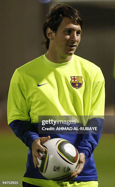 Barcelona's Argentine striker Lionel Messi attends a training session in the Gulf emirate of Abu Dhabi on December 18 on the eve of their 2009 FIFA...