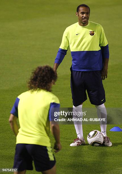 Barcelona's French forward Thierry Henry attends a training session in the Gulf emirate of Abu Dhabi on December 18 on the eve of their 2009 FIFA...