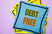 Writing text showing  Debt Free. Business photo showcasing Credit Money Financial Sign Freedom From Loan Mortage written on sticky note paper on the pink background.