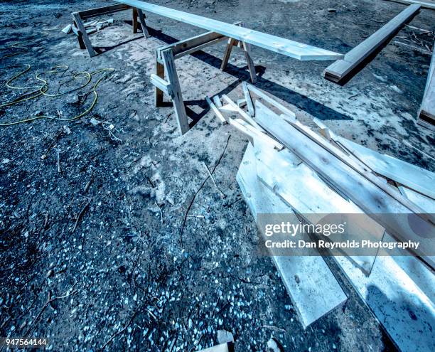 wood on sawhorse at new home construction site - sawhorse stock pictures, royalty-free photos & images