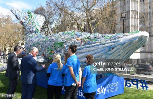 Britain's Prince Charles, Prince of Wales looks at a model of a whale, made from plastic bottles as part of the Sky Ocean Rescue Campaign, on the...