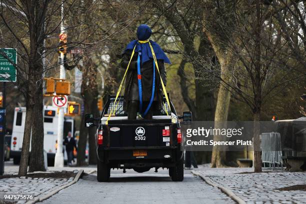 Statue of J. Marion Sims, a surgeon celebrated by many as the father of modern gynecology, is driven away in a Parks Department truck after being...