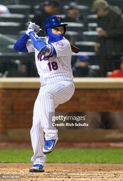 Travis d'Arnaud of the New York Mets in action against the Philadelphia Phillies during a game at Citi Field on April 3, 2018 in the Flushing...