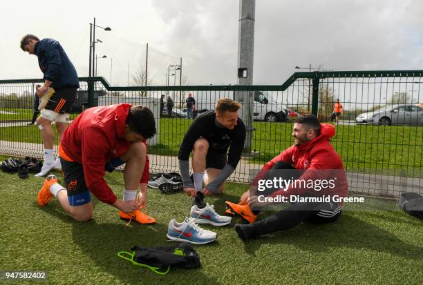 Limerick , Ireland - 17 April 2018; Alex Wootton, Rory Scannell, and Sammy Arnold in conversation as they tie their boot laces prior to Munster Rugby...