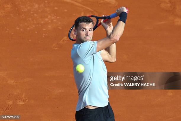 Bulgaria's Grigor Dimitrov returns the ball to France's Pierre-Hugues Herbert during their round of 32 tennis match at the Monte-Carlo ATP Masters...
