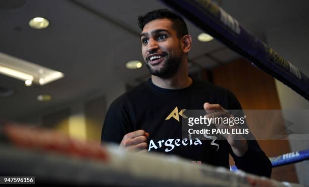 Britain's Amir Khan attends a pre-fight public work out at Paradise Place in Liverpool on April 17 ahead of his welterweight boxing bout against...