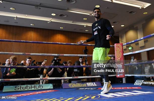 Britain's Amir Khan attends a pre-fight public work out at Paradise Place in Liverpool on April 17 ahead of his welterweight boxing bout against...