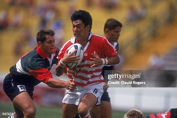 Toru Kurihara of Japan runs through during the Rugby World Cup 7's match against Zimbabwe held at Mar Del Plata, in Argentina. Japan won the match...