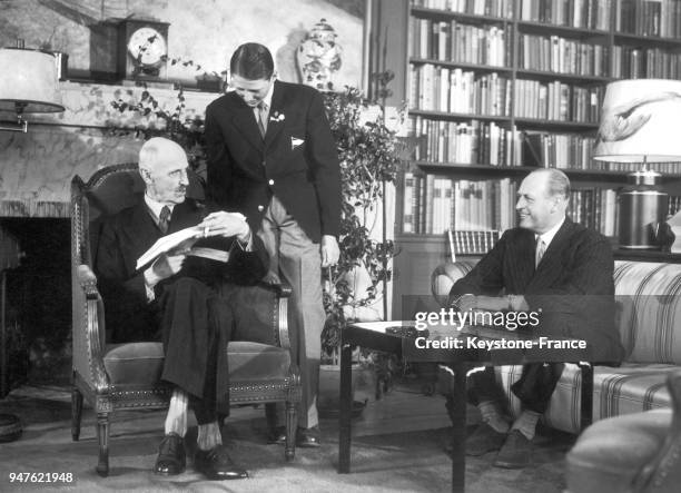 Three generations of monarchs of Norway posing in Skaugum Royal Palace's librairy : King HAAKON VII of Norway, Prince HARALD and King OLAV V ....